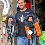 Neal Turner showing just two of the makes of lifejacket on sale at Newline Chandlery – right is the Challenger and left is the Kru.