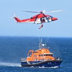 Buckie lifeboat William Blannin holds station as the winchman is recovered to the rescue helicopter Bond 1.