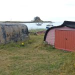 Old upturned hulls are put to good use as fishermen’s gear stores on Holy Island.