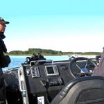 Fishery officers Sam Dell and David Mayne onboard SIFCA’s patrol vessel in Poole Harbour.