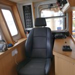 18. The skipper’s seat to starboard, with controls on either side.