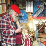 Des Pawson does knots – which, here in his workshop, make a boat fender...