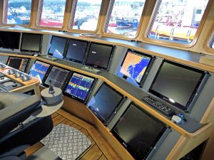 The main forward console in the well-finished wheelhouse…