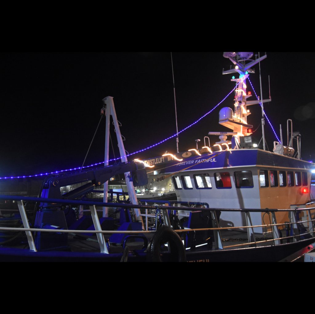 Blue is the colour on the Blue Toon trawler Forever Faithful, complete with decorated landing crane and aft mast.