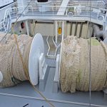 Two net drums are aligned with hydraulically operated shooting gates and rollers across the stern of Girl Stephanie...