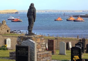 Lifeboat crews pay their respects at the lifeboat memorial at Kirk Hope.
