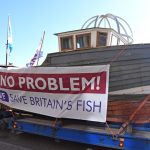 … led a symbolic coble on a specialist low-loader from North Shields to Newcastle quayside, before crossing the Tyne Bridge en route to Jarrow.