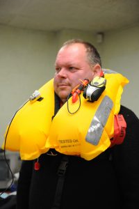 Clive Palfrey with the latest Mullion lifejacket designed for fishermen.