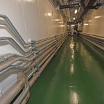 … from which pipes run to the forward system, and vice versa, to give full duplication at all times. The insulated recycled hot water pipes are on the starboard side of the passageway.