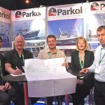 Leonard Anderson of LCL Shipping (second left) signs the contract for Parkol to build a 27m salmon feed carrier, watched by Ian Paton, James Morrison, Sally Atkinson and Andrew Oliver.