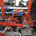 … drives two Kawasaki load-sensing pumps through a JBJ clutched splitter box.