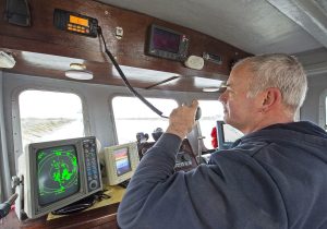 Paul checking boat-to-boat communications on channel 6.