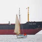 Emma-Louise (skipper Frazer Johns) towing upriver, with the Russian cargo ship Kuzma Minin in the background.