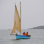 Veruna towing off Mylor, showing her three rope warps off the port side.