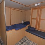 Three beds are arranged on the starboard side of the main eight-berth accommodation cabin.
