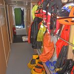 An extensive selection of protective clothing is ready for use in the port passageway…