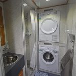 Clothes-washing and drying facilities are built into the shower room.