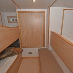 Two three-berth cabins lie either side of the steering gear compartment.