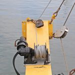 Tipping winches are mounted athwartships on the stern gantry.