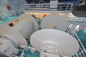 Two underspooled net drums are arranged at boat deck level.