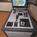 Vessel manoeuvring consoles are located on either side of the wheelhouse.