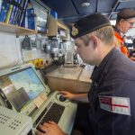Correspondence officer Lt Joseph Darwell assisting the ship’s departure using the warship electronic chart display information system (WECDIS).
