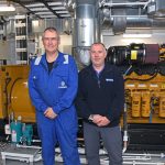 Zephyr chief engineer Brian Irvine and David Henry of DH Marine, with one of the six Caterpillar gensets supplied and installed by DH Marine as part of a bespoke electrical power management system.