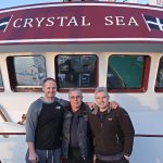 Crystal Sea skippers David and Alec Stevens with their father David Stevens.