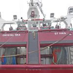 Twin-rig trawling arrangements across Crystal Sea’s transom.