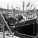 The Blejan Eyhre berthed at its home port of Mevagissey in 1984. Built at J Moor & Son and launched in 1978, it was the last fishing boat of traditional lines built at the yard.