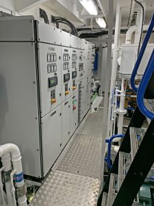 The main electrical cabinets are positioned across the fore end of the engineroom.