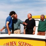 After the sea trials of the first Buccaneer B19 in 2000, designer Gary Mitchell (second from left) seems pleased with what was to become one of the fastest-selling GRP boats of that size.