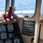 The mascot for the Julie keeps watch in the wheelhouse.