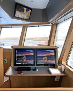 Computer and e-log reporting facilities are provided in a desk area on the starboard side of the wheelhouse.