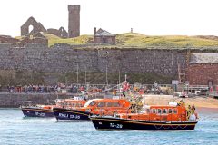 The new Peel 13m Shannon lifeboat Frank and Brenda Winter, flanked by the station’s former and temporary boats Ruby Clery and Mary Margaret, under Peel Castle.