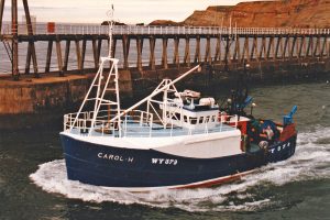 Carol H heads out between the Whitby pier-ends at the beginning of a trip fishing the local inshore hard ground.
