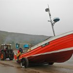 … before the coble is hauled up the beach.