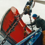 Crewman David Smith chaining up the Perfect B 600kg starboard trawl door.