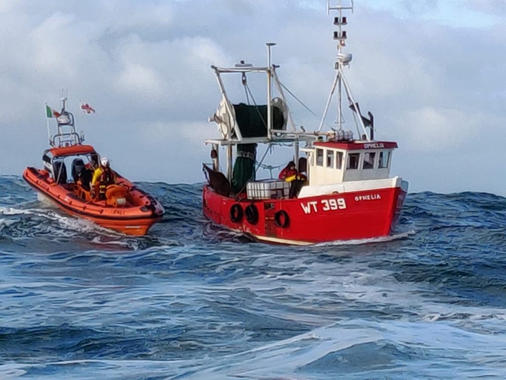 Two lifeboat crew were transferred onboard Ophelia to assist with pumping out the flooded vessel. (Photo: Clifden RNLI)