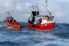 Two lifeboat crew were transferred onboard Ophelia to assist with pumping out the flooded vessel. (Photo: Clifden RNLI)