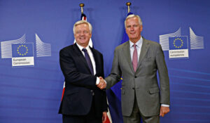 UK and EU chief negotiators David Davis and Michel Barnier shake hands