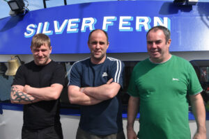 Skipper Martin MacInnes (centre) with crewmen Aaron Edwards (standing in for Ronan MacInnes) and Angus MacFarlane (right).